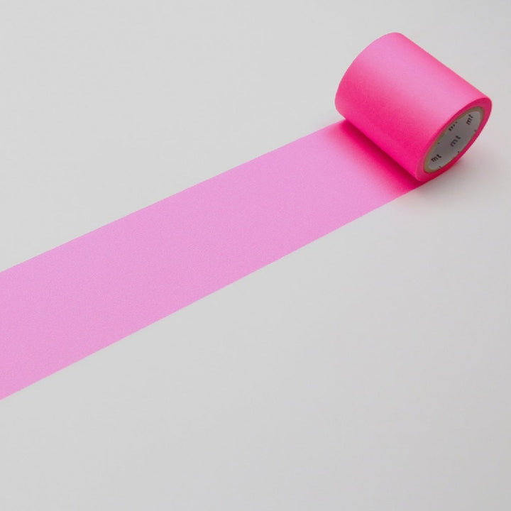 Pink tape roll on a light gray background