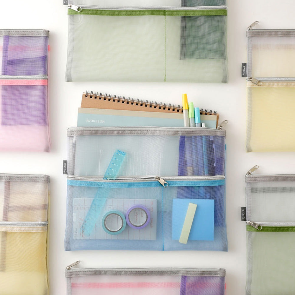 Midori’s Pen & Tool Mesh Pouch - Large (B5) in pastel colors, shown empty and filled with stationery like notebooks, pens, rulers, washi tape, and sticky notes—perfect for staying organized.