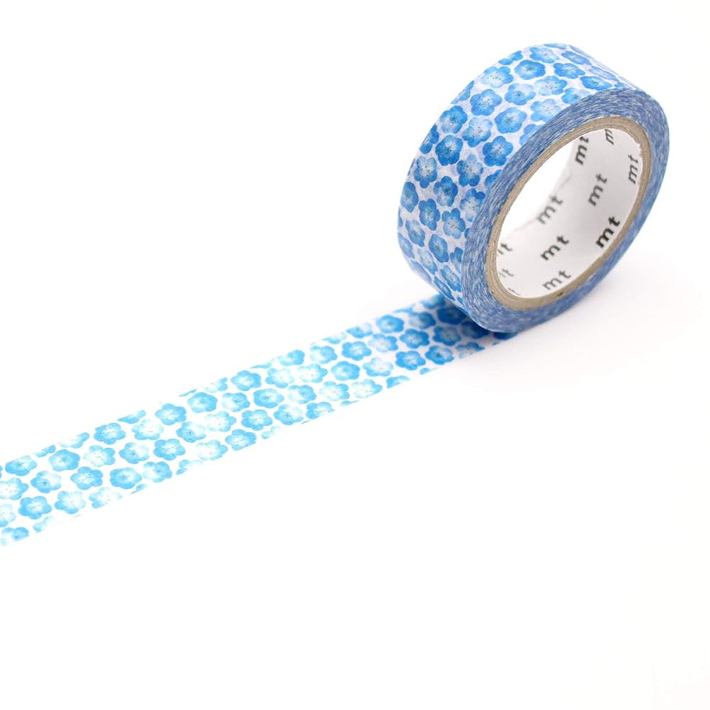 Roll of blue patterned tape with a white label on a white background