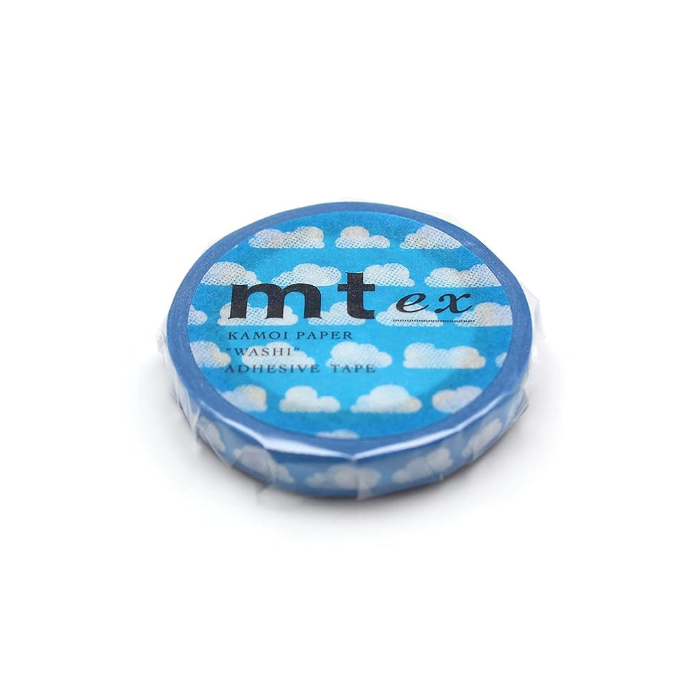 A roll of tape wrapped in cellophane. The tape is blue with white clouds, and the sticker that seals the cellophane has a matching design, featuring 'mt ex' branding. All on a white background. 