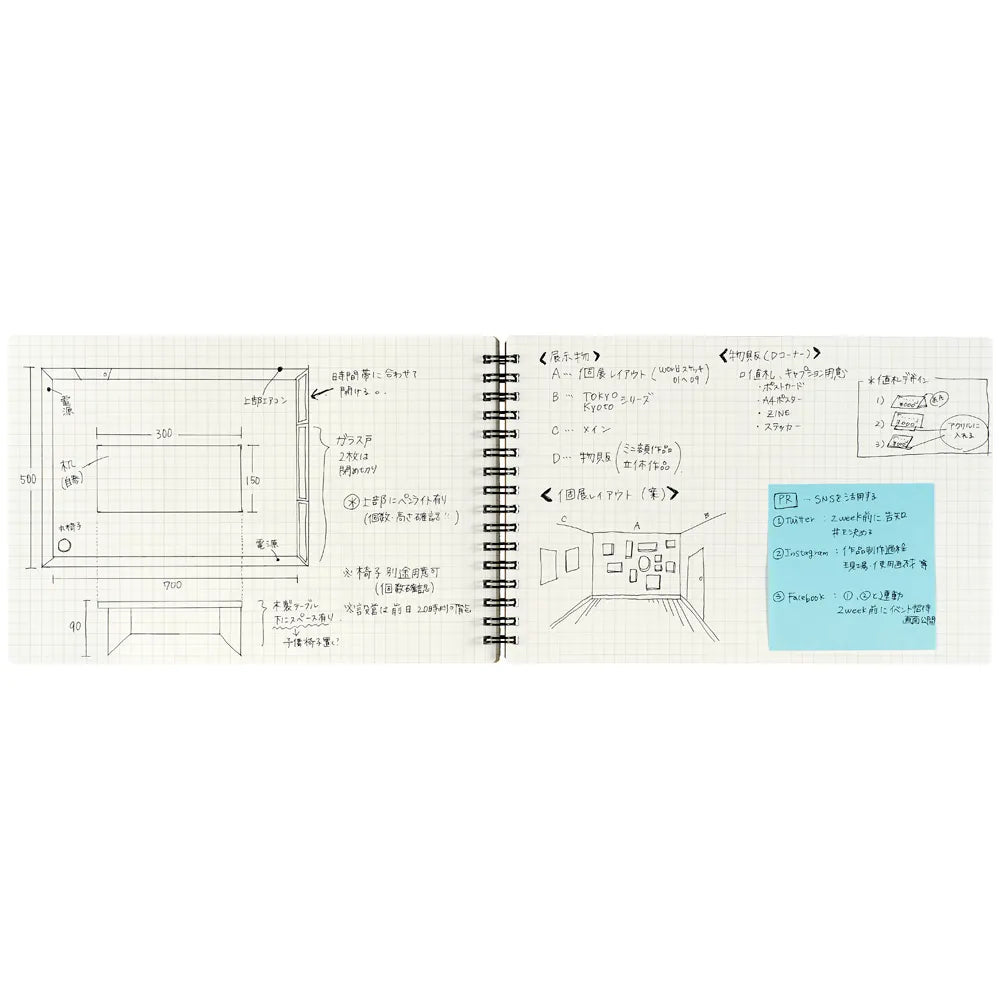 Open notebook with architectural floor plan and notes on a white background #paper-type_5mm-grid
