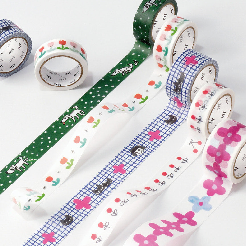 Collection of colorful washi tape rolls on a white background